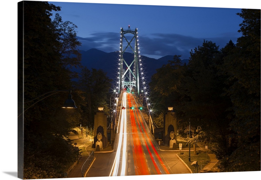 Long Exposure Twilight Image Of The Lions Gate Bridge With Car Headlights Streaking Over The Bridge; Vancouver, British Co...