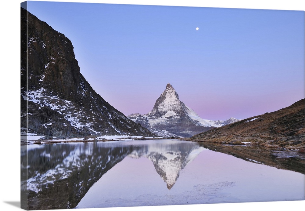 Matterhorn reflected in Lake Riffelsee at Dawn with Moon, Zermatt, Alps, Valais, Switzerland