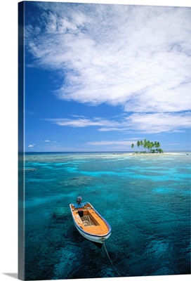 Micronesia, Small Boat In Turquoise Waters Off Small Island With Palm Trees