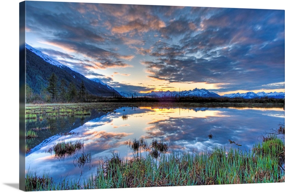 Morning sky reflecting on a pond near the Copper River Highway outside of Cordova.  Four image HDR composite.