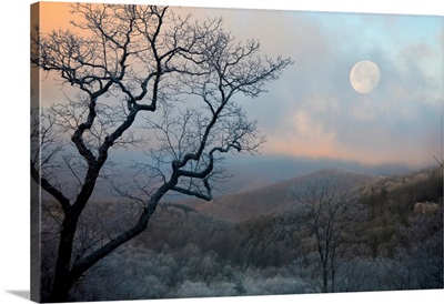 Nearly Full Moon Sets Over The Mountains At Sunrise