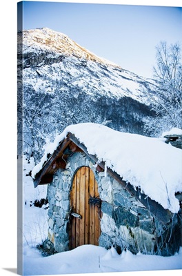 Norway, Sognefjord, snow covered traditional stone building