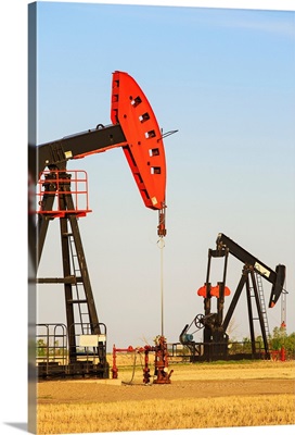 Oil well pump jacks at Bakken Oil Field near Estevan, Saskatchewan, Canada