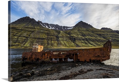 Old Shipwreck Along The Water In Mjoifjordur, East Iceland, Iceland