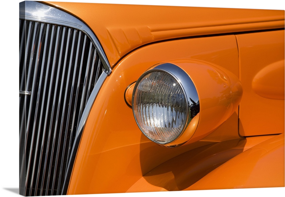 Orange Painted Vintage Car's Headlight And Front Grill; Port Colborne, Ontario, Canada