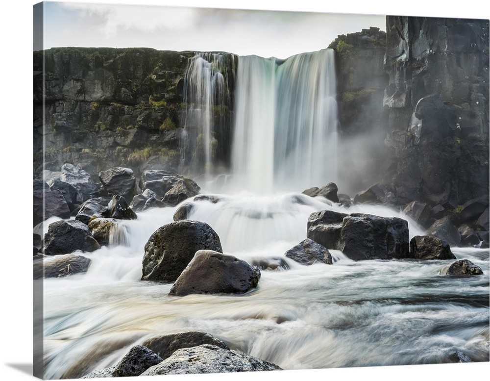 Oxararfoss waterfall in Thingvellir, a historic site and national park.  It's known for the Althing, the site of Iceland's...