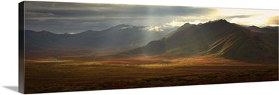 Panoramic Image Of The Cloudy Range With Shafts Of Sunlight, Yukon, Canada