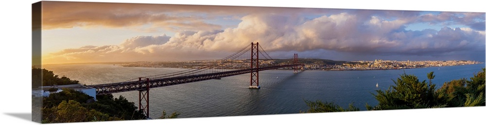Panoramic view of 25 de Abril Bridge at sunset and cityscape of Lisbon, Lisbon, Portugal