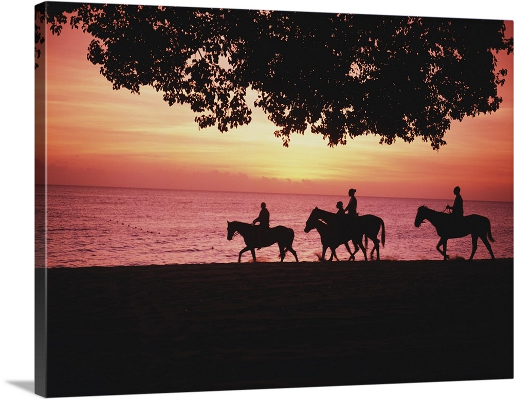 Riding Horses On The Beach At Sunset