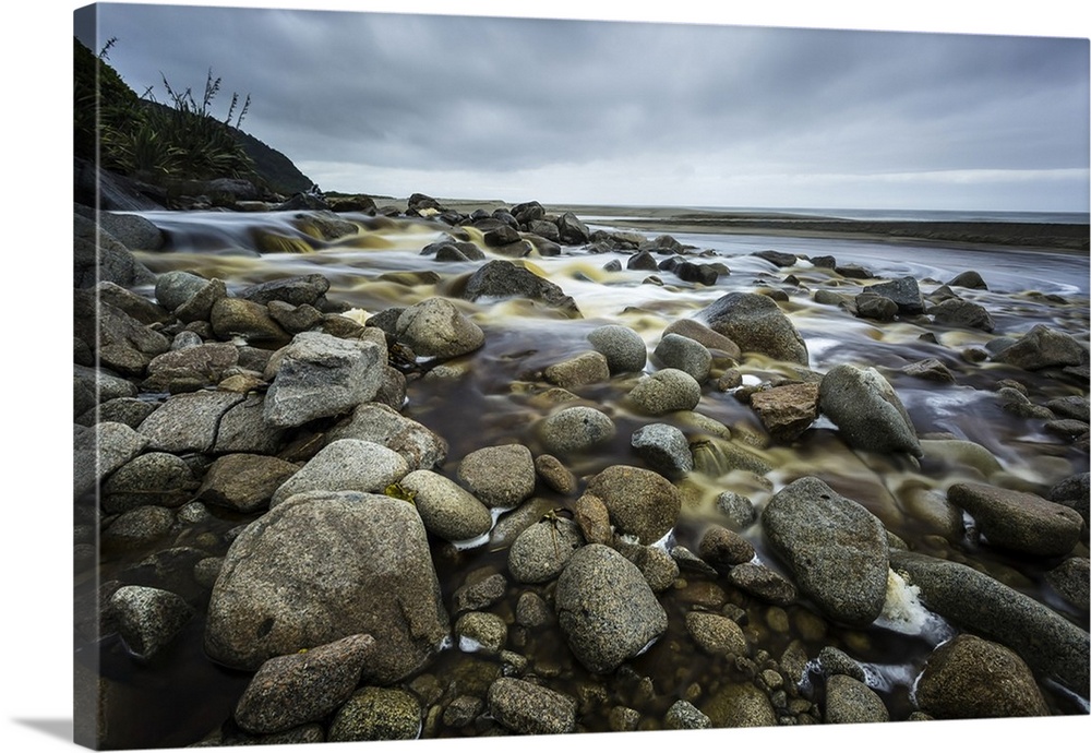 Rocky Karamea stream making it's way to the sea; Karamea, New Zealand