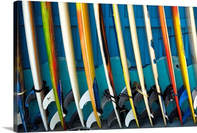 Row Of Surfboards Lined Up Against A Wall