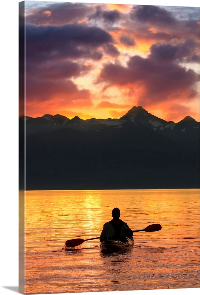 Sea Kayaking on a sublime evening in Lynn Canal near Eagle Beach State Recreation Area, Juneau, Alaska. Chilkat Mountains ...