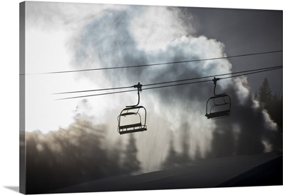 Silhouette of a chairlift on a ski hill back lit by the sunlight, Copper Mountain Resort