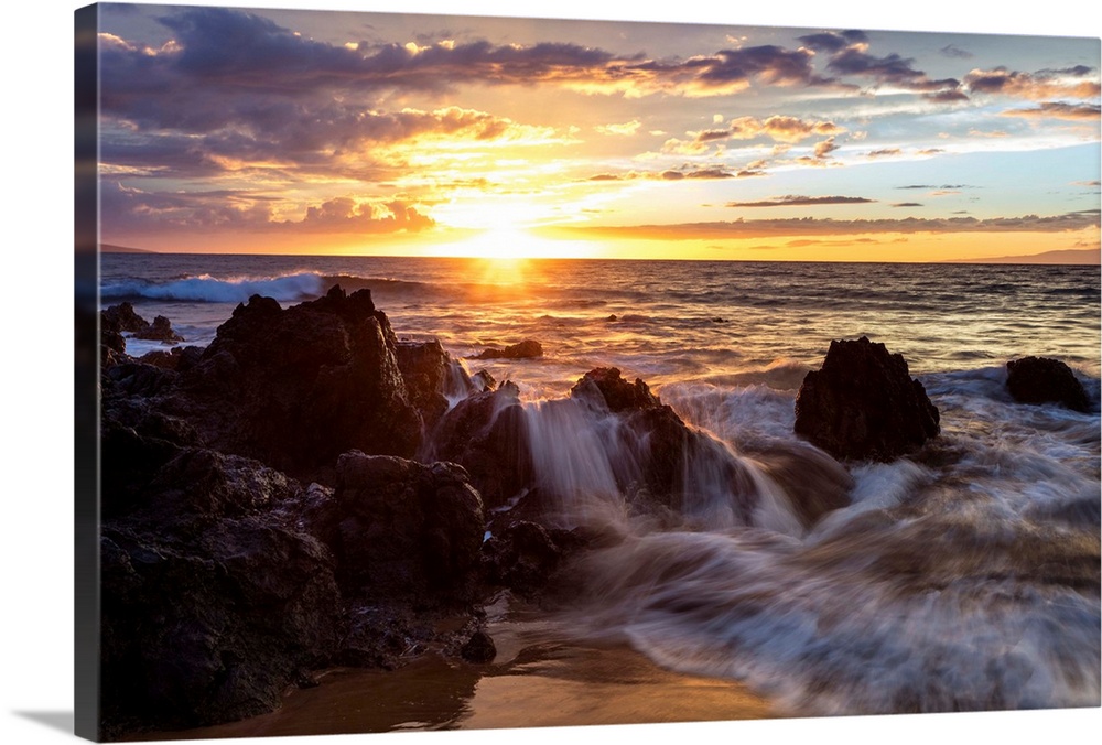 Soft water over lava rocks during sunset; Makena, Maui, Hawaii, United States of America.