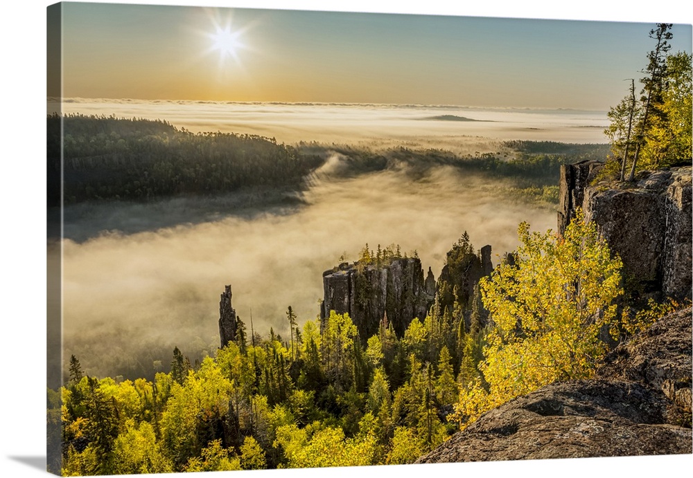 Sunrise over a misty, foggy valley in the Canadian Shield; Dorian, Ontario, Canada.