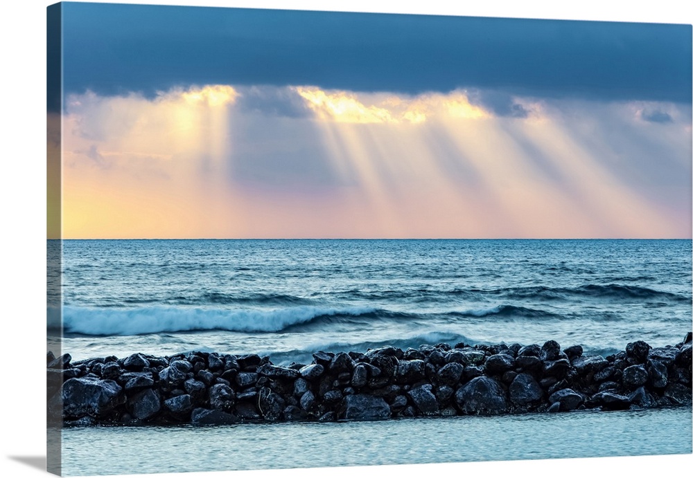 Sunrise over Lydgate Beach and the ocean from the coast of Kauai with a breakwater; Kapaa, Kauai, Hawaii, United States of...