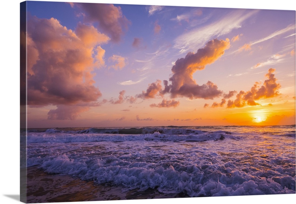 Sunrise over the Atlantic Ocean with the surf washing up on the shore; Indialantic, Florida, United States of America