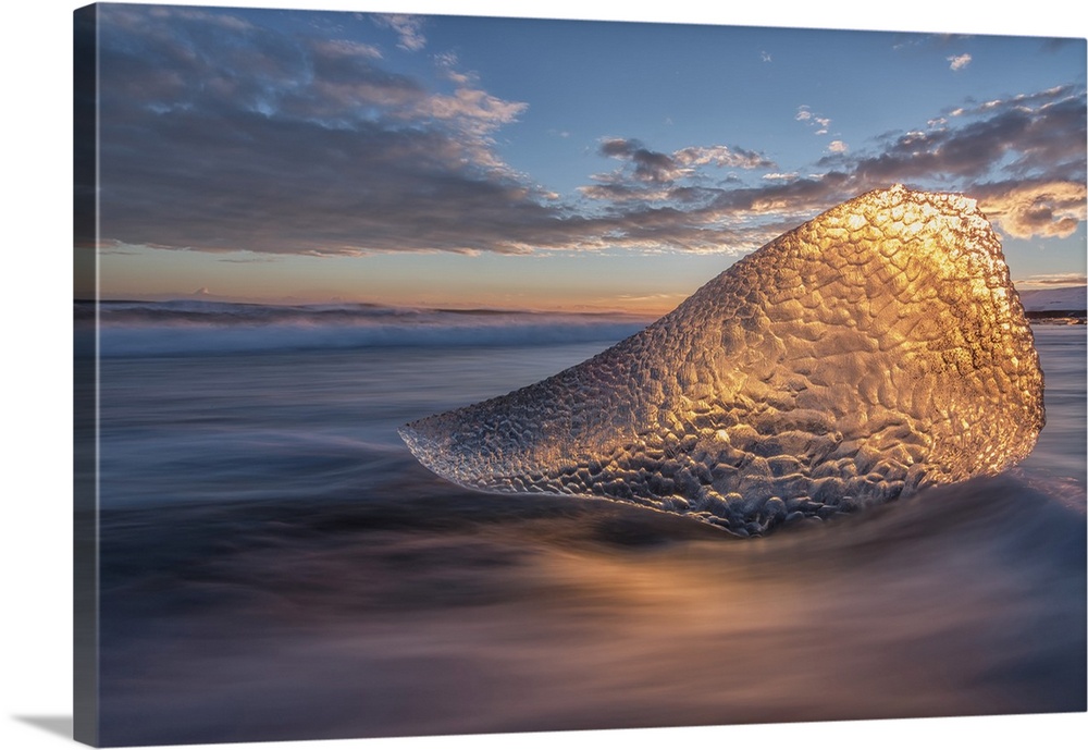 Sunset Light Is Shining Through A Piece Of Ice Along The South Coast Of Iceland, Iceland