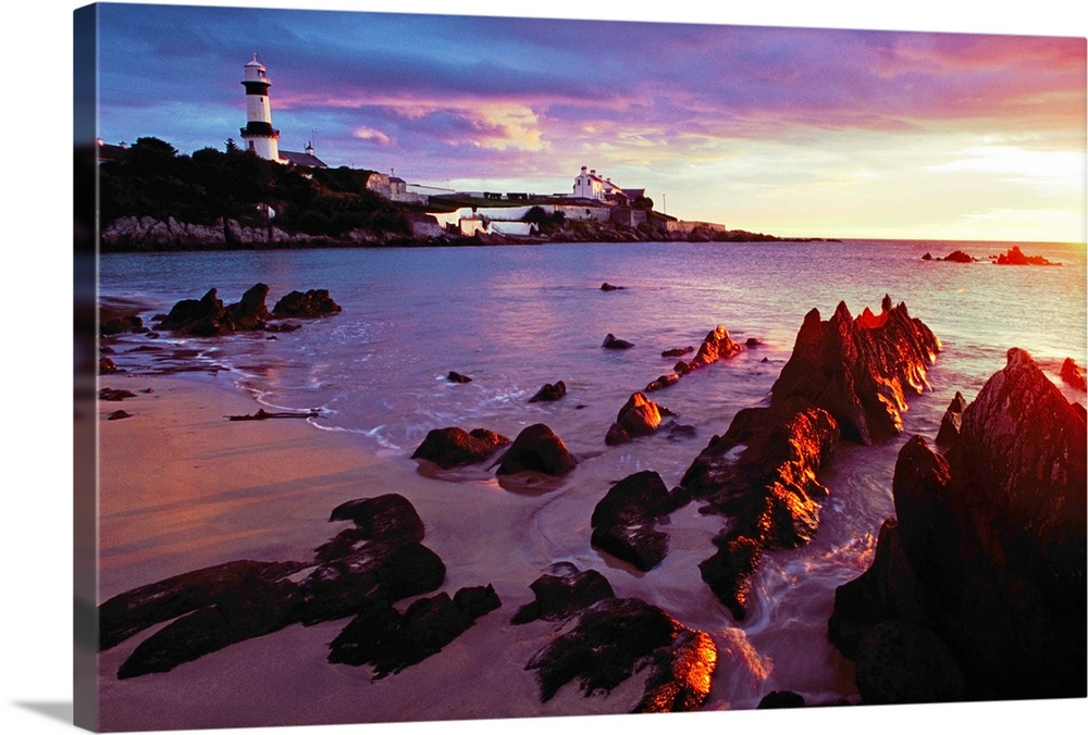 Sunset Over Beach With Lighthouse