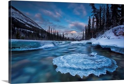 Sunset Over Ice-Covered Rock In Wheaton River, Yukon Canada