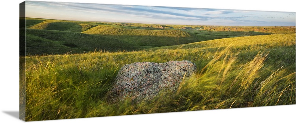 Sunset Over The Coulees And Buttes Of Grasslands National Park With Erratic In Foreground; Saskatchewan, Canada