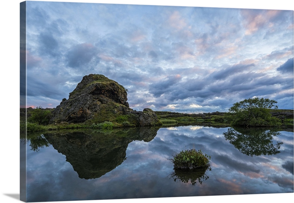 Sunset over the old lava and small pond near Lake Myvatn, North Iceland; Iceland