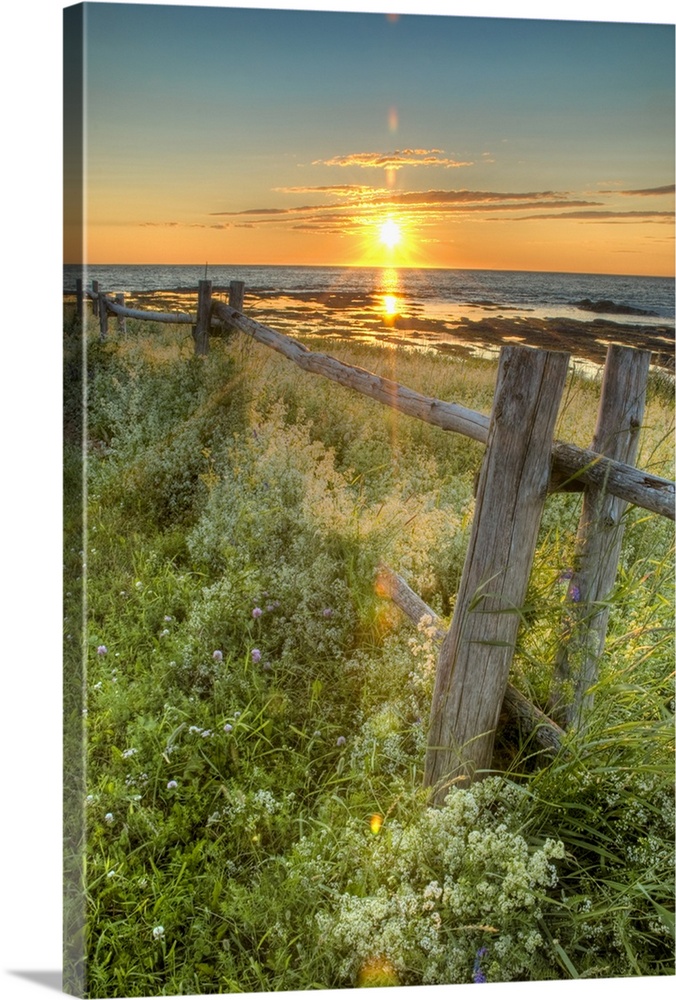 Sunset Over Water With Fence Along The Shoreline; La Martre, Quebec, Canada