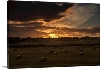 Sunset With Dark Clouds Over A Field With Hay Bales, Whitburn, Tyne And Wear, England