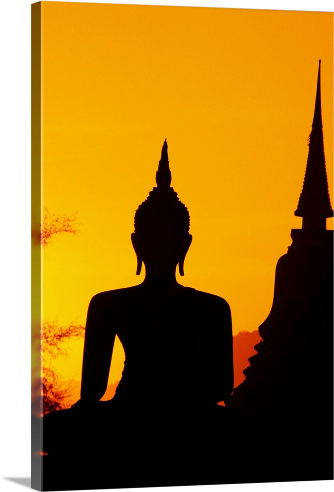Thailand, Sukhothai, Buddha And Temple Silhouetted At Sunset