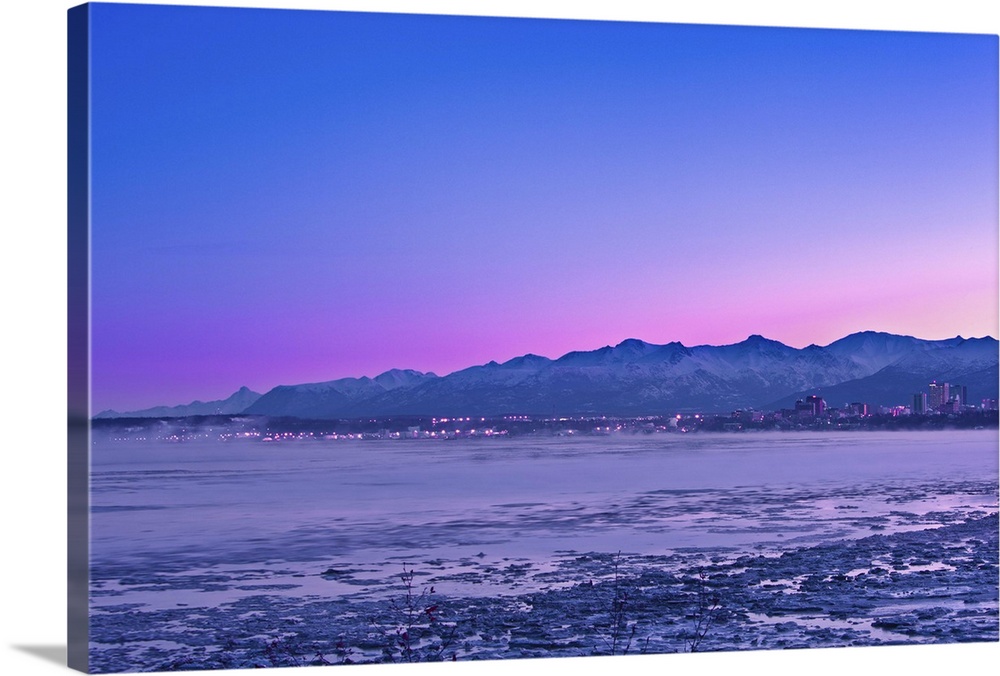 The Anchorage Skyline before dawn with fog rising from the waters of Knik Arm as seen from Earthquake Park, Southcentral, ...