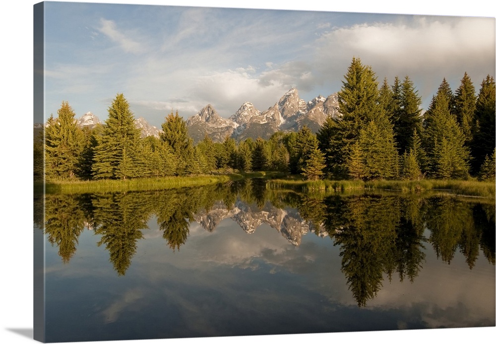 The Grand Tetons reflected in Snake River in Grand Teton National Park Wyoming, United States of America