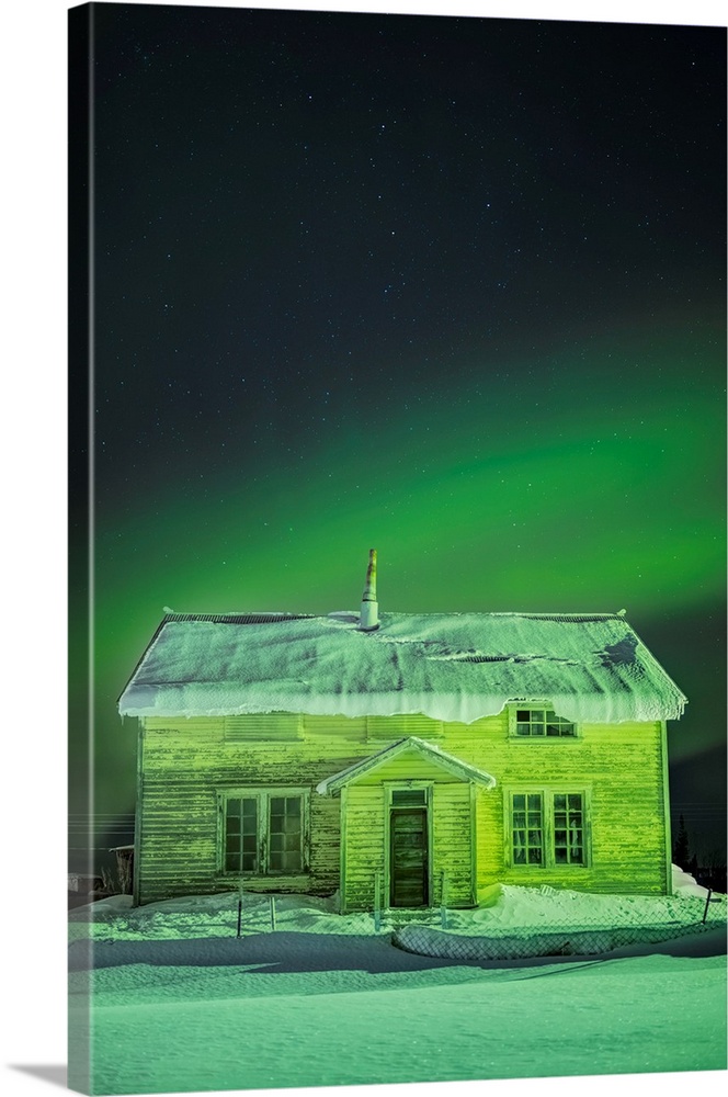 The Northern Lights in the sky above 'Our Lady of the Snows' Catholic Mission Building in winter, Nulato, Interior Alaska,...