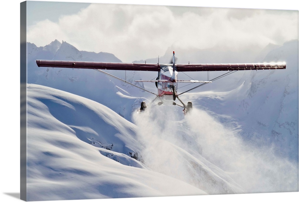 View of a Super Cub air taxi at Tanaina Glacier in the Neacola Mountains, Aleutian Range, Alaska, Winter.