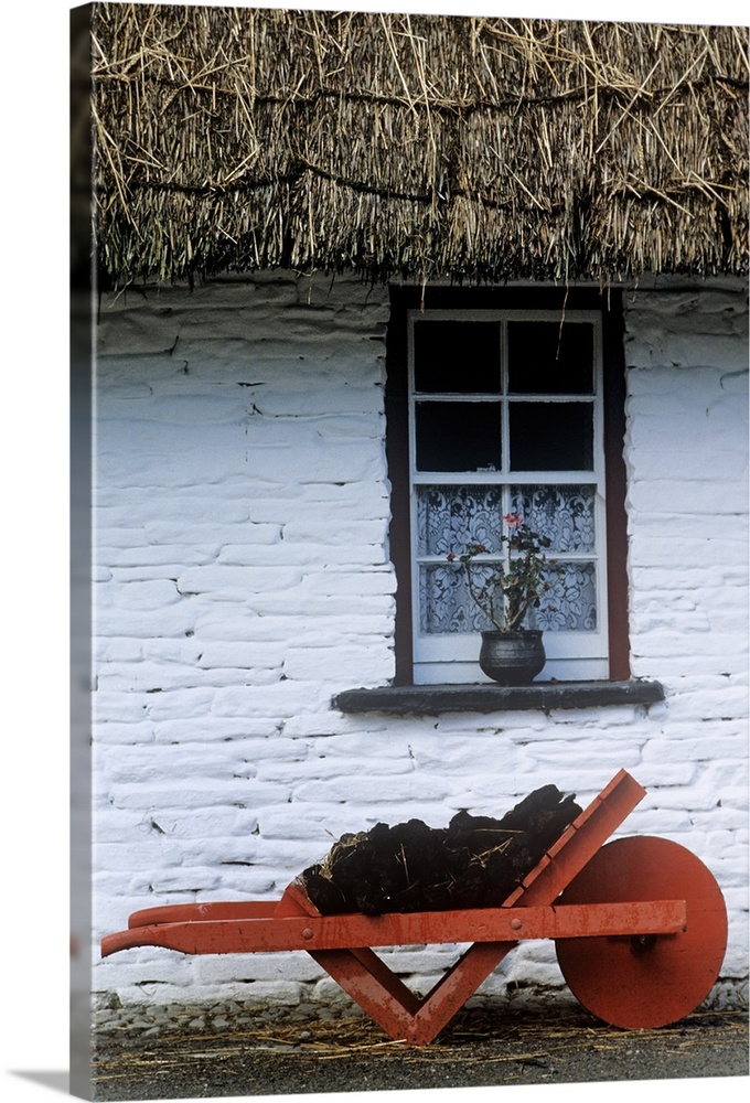 Wheelbarrow In Front Of A Window Of A Cottage, County Clare, Republic Of Ireland