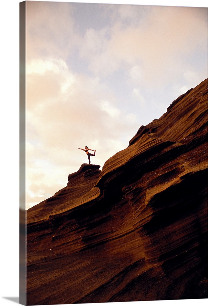 Woman Doing Yoga At Sunrise On Rock Coastline Cliff