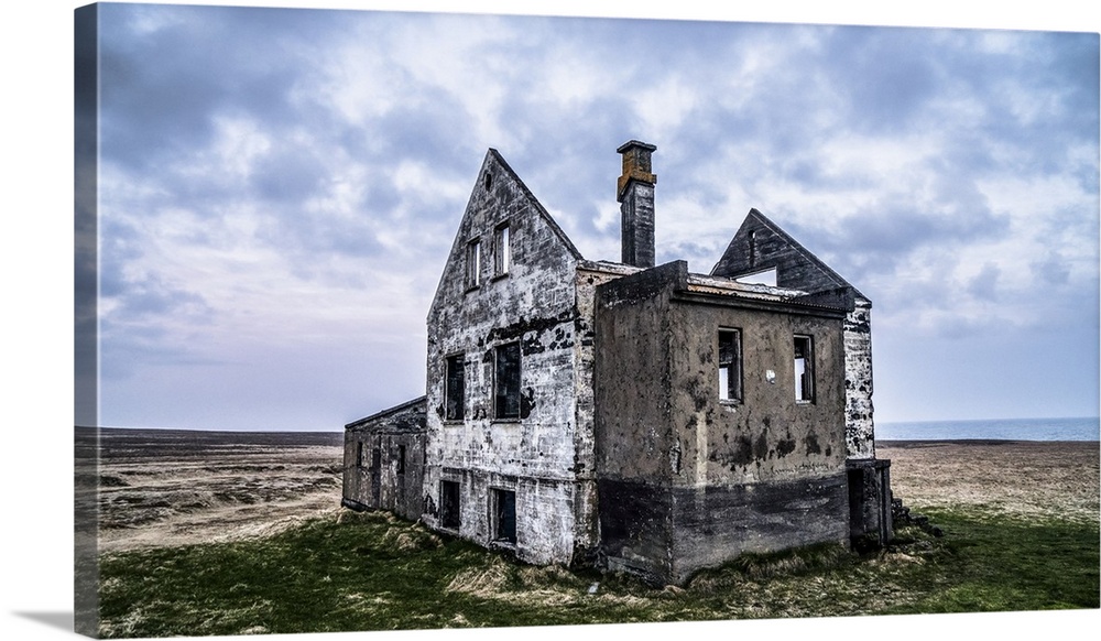 A worn out house in Iceland. Several of these houses exist, sometimes with a newer farm close by or in this case, alone; I...