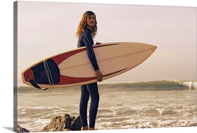Young Woman With Her Surfboard At The Beach, Tarifa, Cadiz, Andalusia, Spain