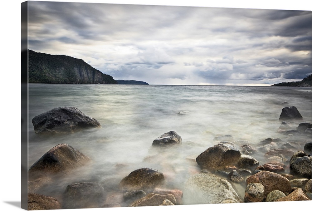 Fine art photograph of a rocky lakeshore under a cloudy sky in Ontario.