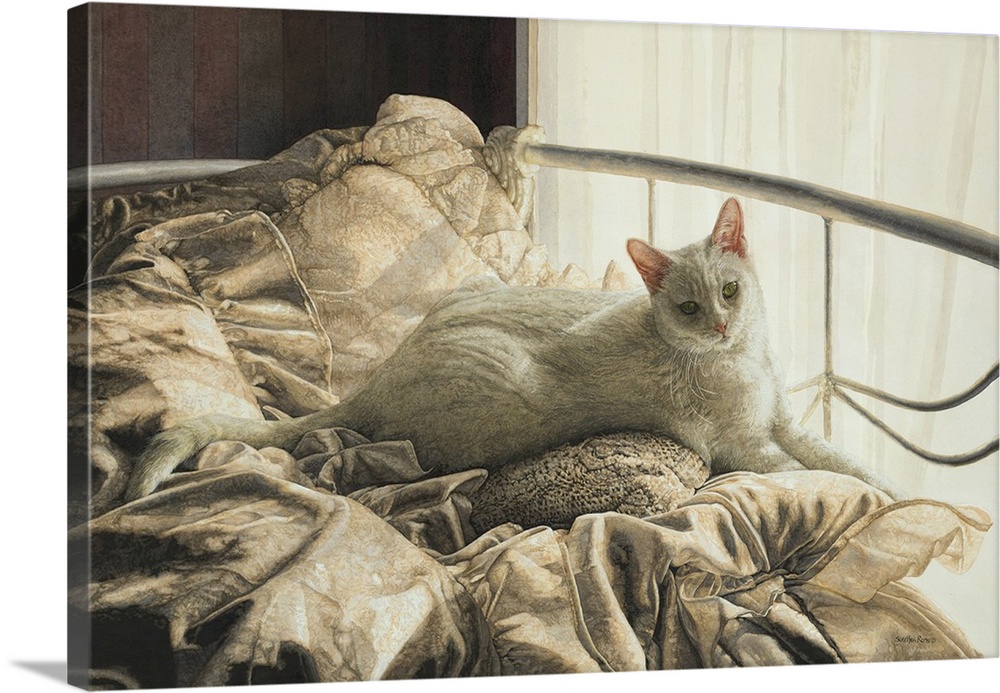 A horizontal image of a white cat paying of a daybed with white covers.