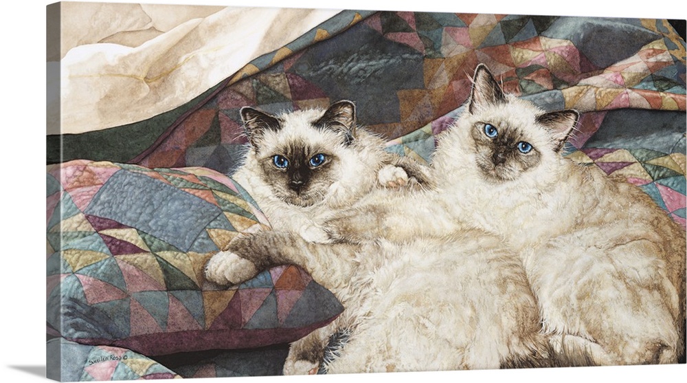 A horizontal image of two cats laying on a pastel quilt.