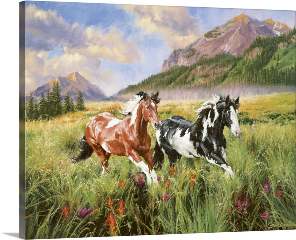 Landscape artwork on a large canvas of two spotted horses running through a grassy field, large mountains in the backgroun...