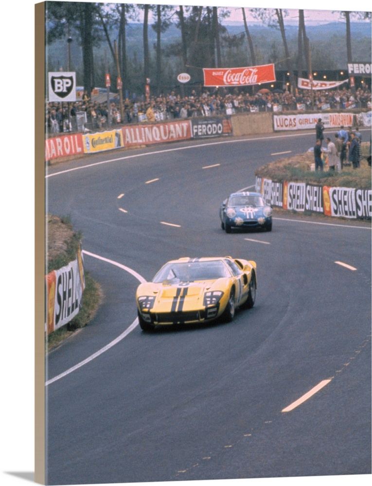 Sir John Whitmore and Frank Gardner in their Ford Mark II in the esses during the 1966 LeMans Race.