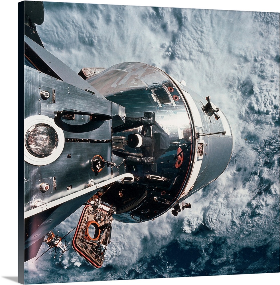 6th March 1969  Docked Apollo 9 command service module beyond and the lunar module spider on the left with Earth in the ba...