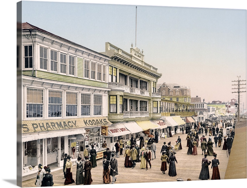 Antique poster of the Atlantic City boardwalk in New Jersey. Shops line the left side with hundreds of people walking outs...