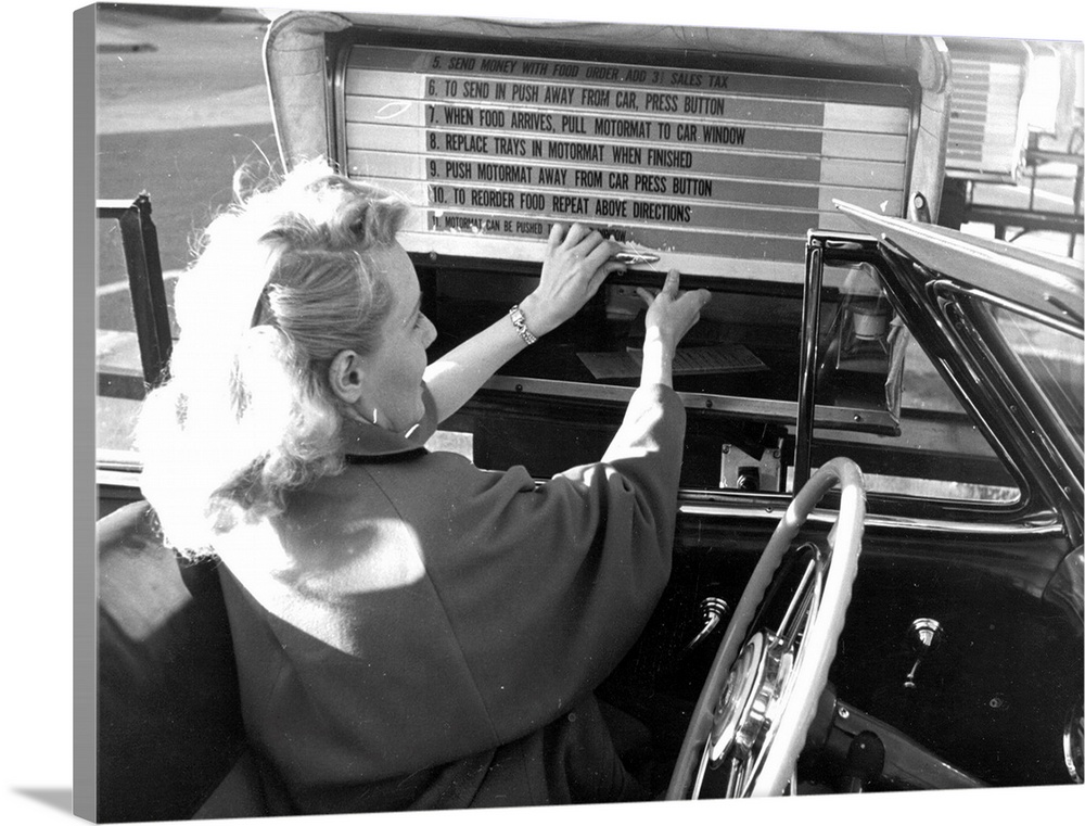 A woman selects a lunch tray at a drive-in 'auto-motormat' in Hollywood  Original Publication: Picture Post - 5298 - We Go...