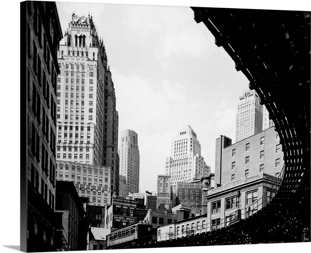 Low-angle view of the elevated train tracks in the Battery, lower Manhattan, New York City, 1930s