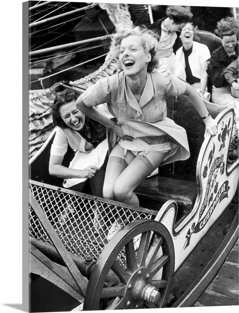 Two young women enjoying themselves on a rollercoaster at Southend Fair, England  Original Publication: Picture Post - 409...