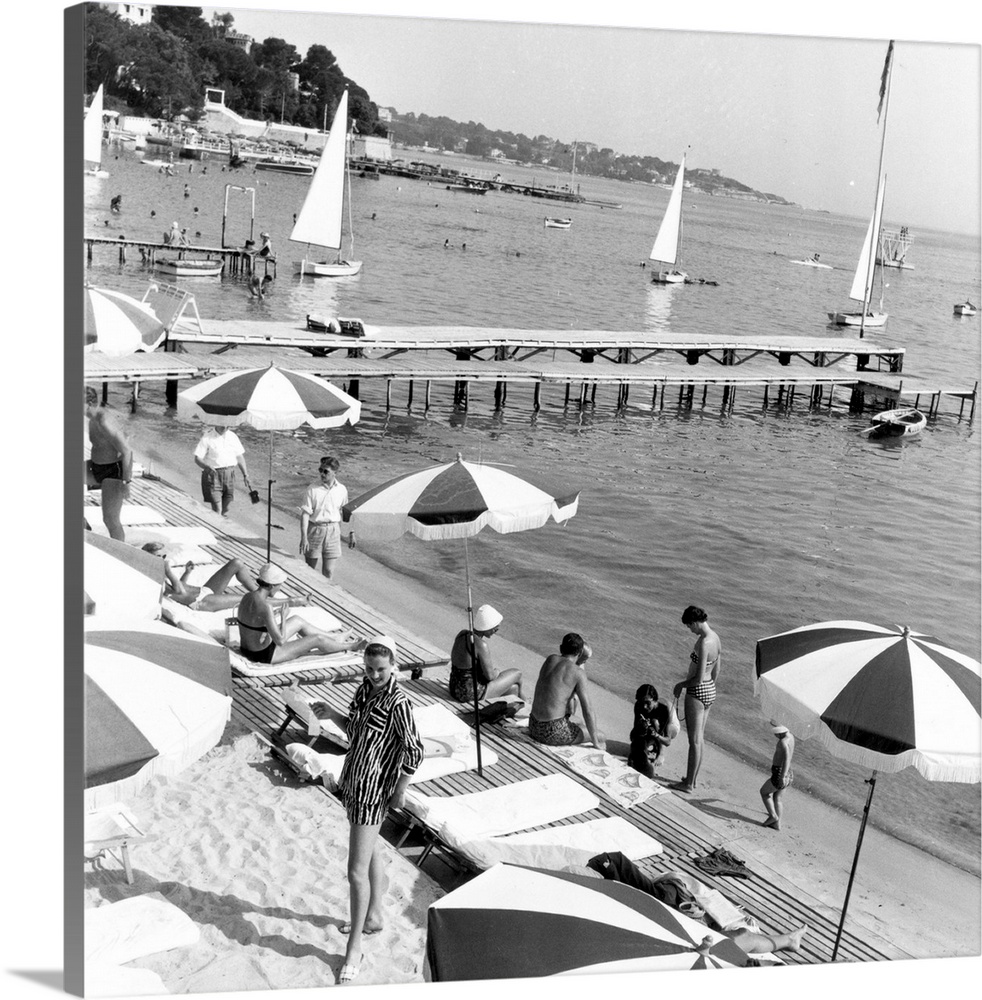 A beach on the French Riviera or Cote d'Azur, where the wealthy come to sunbathe and yacht Original Publication: Picture P...