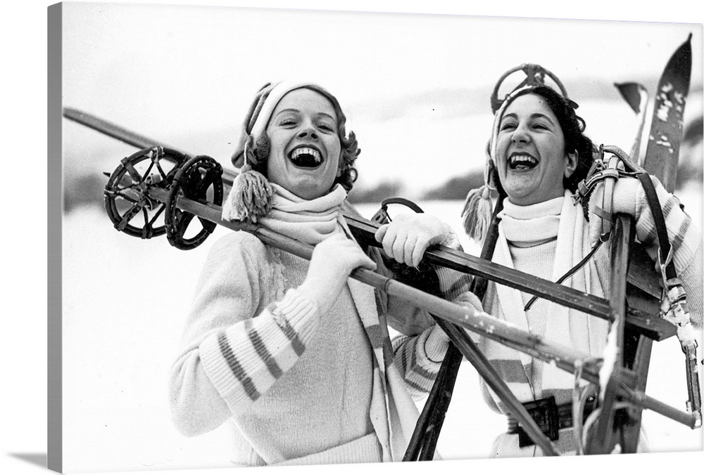 30th January 1937:  Two girls in Oxted off to the hills of Surrey, ready to make the most of the recent snow