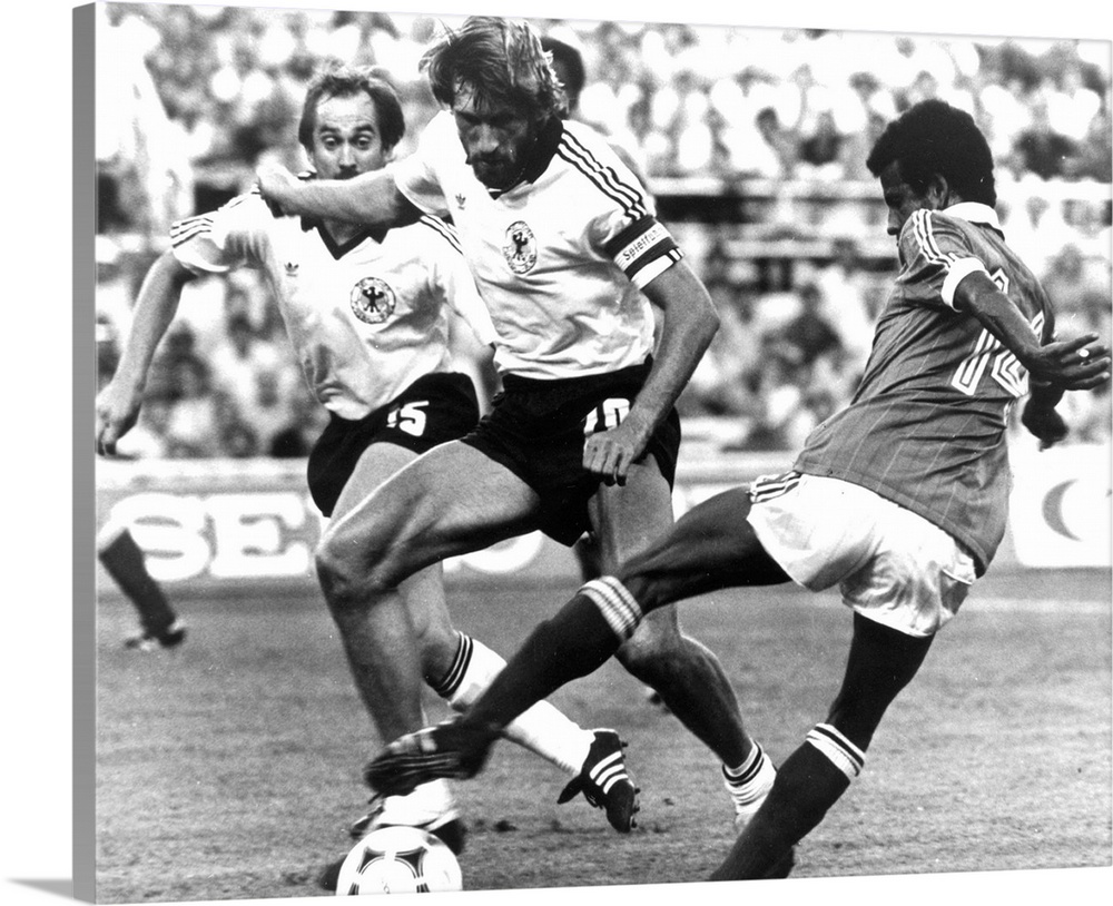 8 Jul 1982:  Jean Tigana of France uses his skill to take the ball past Manfred Kaltz of West Germany during the FIFA Worl...
